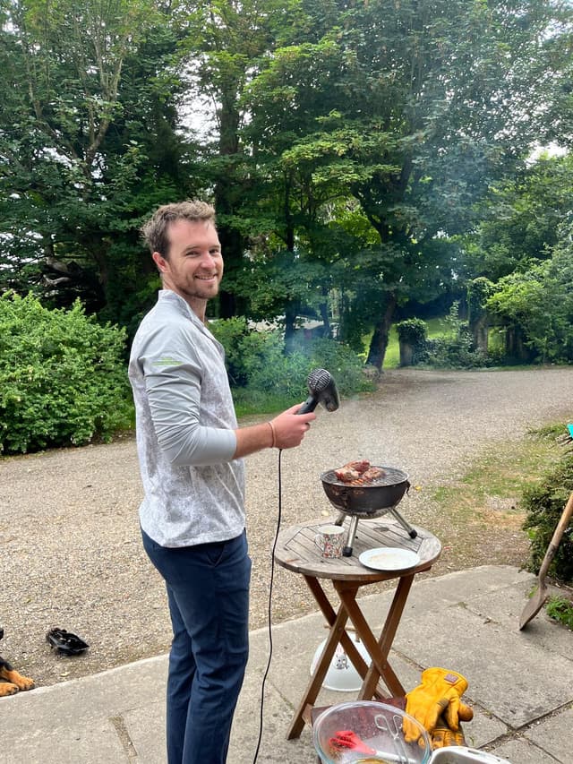 CP Doyle using a hairdryer on charcoal